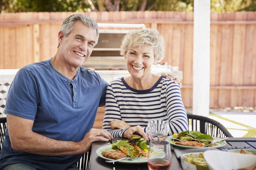 Couple enjoying healthy nutrition with a balanced meal to support optimal health and healthy eating habits