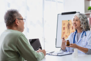 Patient speaking with a healthcare professional about hormonal health and hormone optimization as part of an individualized treatment plan.
