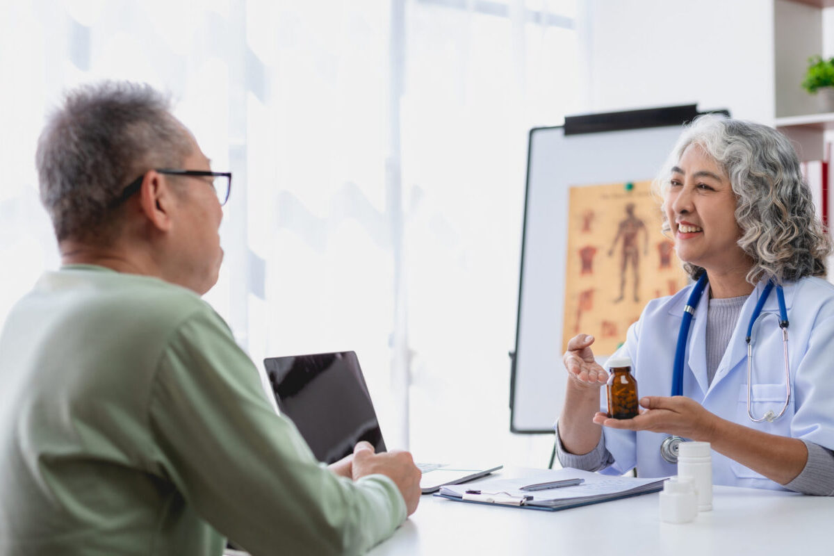 Patient speaking with a healthcare professional about hormonal health and hormone optimization as part of an individualized treatment plan.